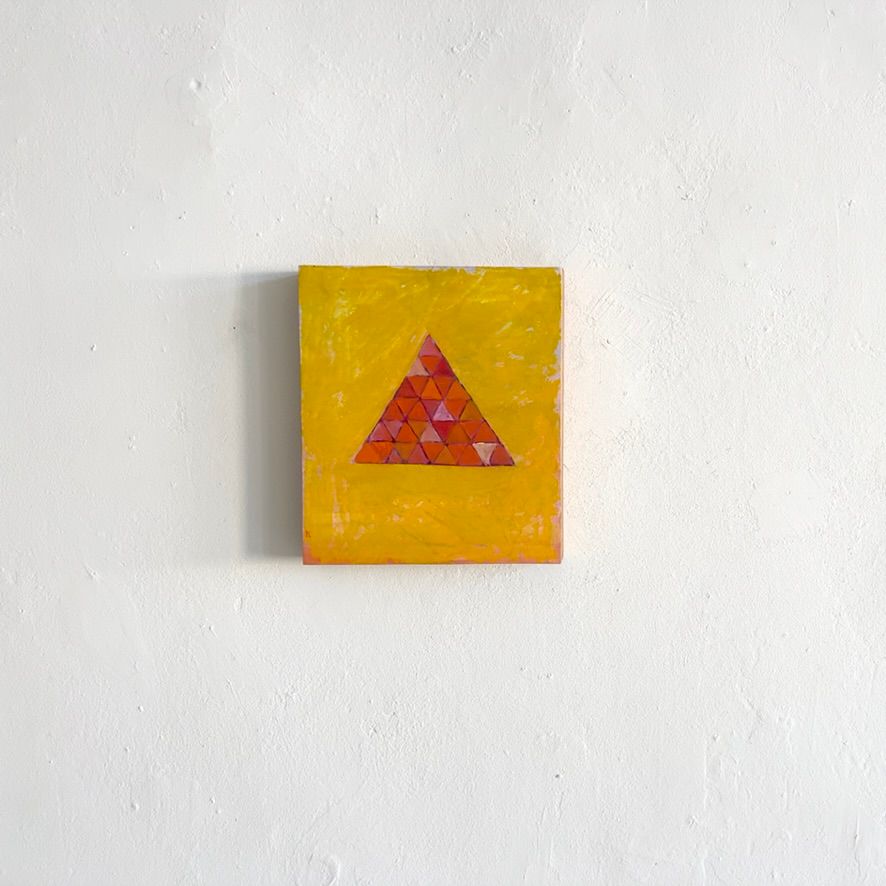 A painting of a yellow background with an orange triangle subdivided into smaller triangles.
