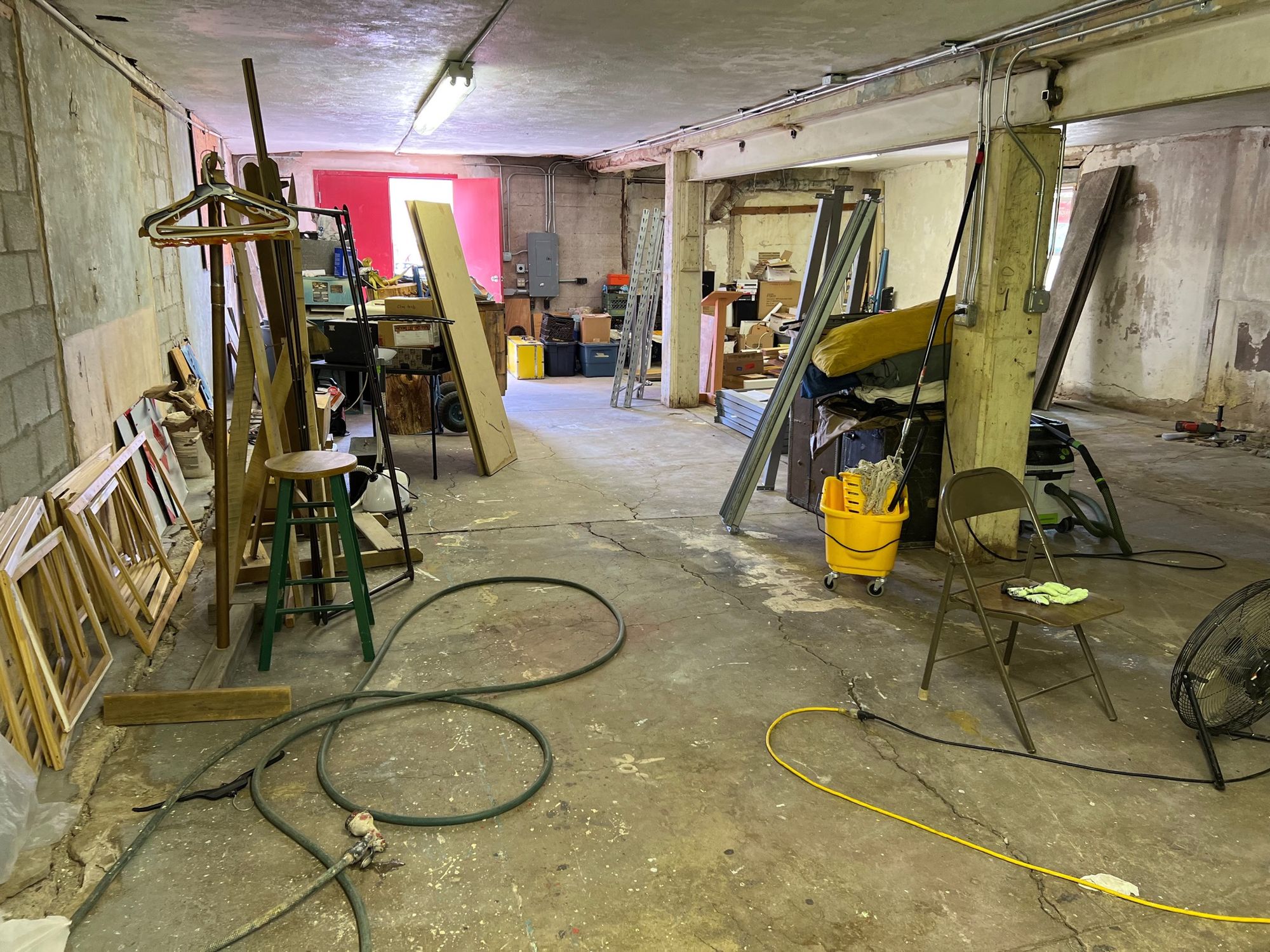 A large basement filled with junk.