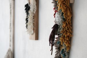 Handwoven many-colored pile woven churro wool wall hanging sculpture