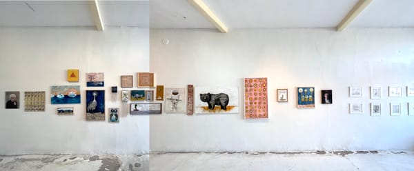 Numerous paintings arranged on a gallery wall. The paintings are both abstract and  future technologies.